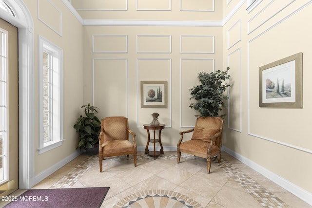 428 Sophee Ln, Lakewood, NJ 08701 - living area with inlaid floor details, healthy amount of natural light, and crown molding