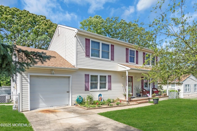 2010 Pine Meadow Ave, Toms River, NJ 08753 - view of front of home featuring covered porch, an attached garage, driveway, and a front lawn