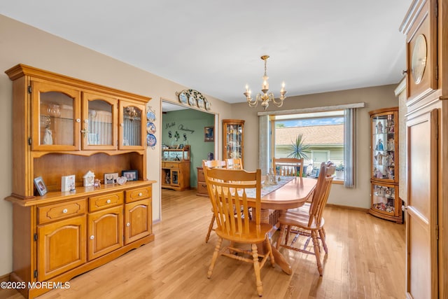 2010 Pine Meadow Ave, Toms River, NJ 08753 - dining space with a chandelier and light wood-type flooring