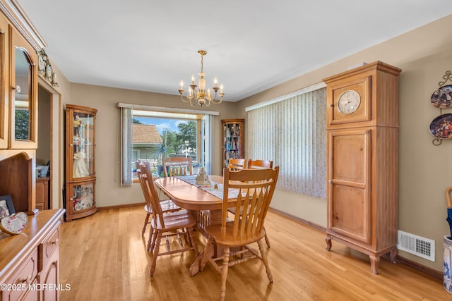 2010 Pine Meadow Ave, Toms River, NJ 08753 - dining room featuring a chandelier and light wood finished floors