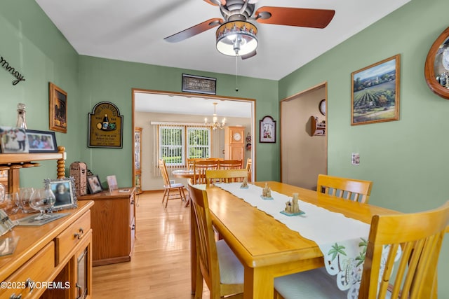 2010 Pine Meadow Ave, Toms River, NJ 08753 - dining room featuring a ceiling fan, light wood finished floors, and a chandelier