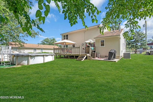 2010 Pine Meadow Ave, Toms River, NJ 08753 - rear view of house with a wooden deck, a covered pool, and crawl space