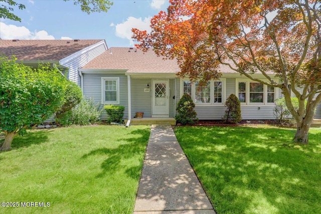 128 Korn Market Unit E, Freehold, NJ 07728 - view of front of property featuring a front yard and roof with shingles