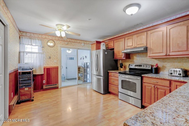 128 Korn Market Unit E, Freehold, NJ 07728 - kitchen featuring stainless steel appliances, a ceiling fan, wallpapered walls, under cabinet range hood, and a wainscoted wall