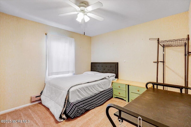 128 Korn Market Unit E, Freehold, NJ 07728 - bedroom with a baseboard radiator, light carpet, and a ceiling fan