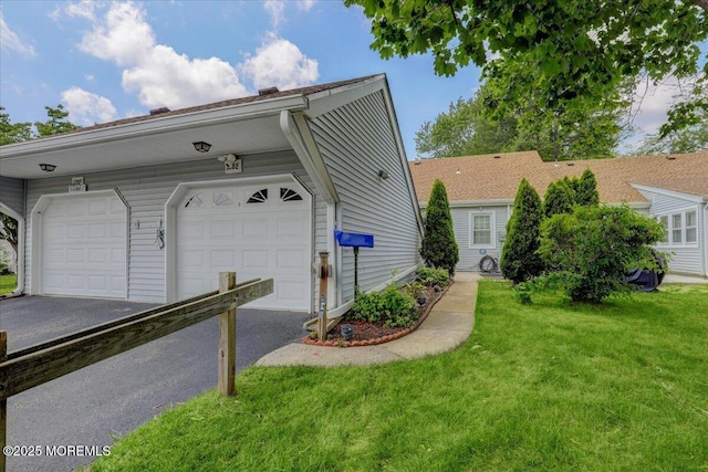 128 Korn Market Unit E, Freehold, NJ 07728 - view of front of property with asphalt driveway and a front lawn
