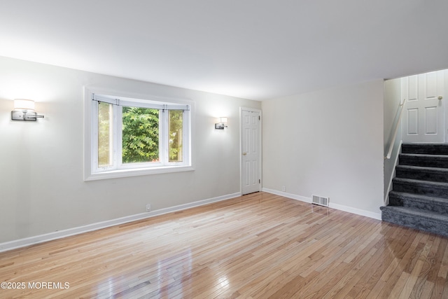 281 Hance Rd, Fair Haven, NJ 07704 - unfurnished living room with light wood-type flooring and stairs