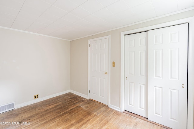 281 Hance Rd, Fair Haven, NJ 07704 - unfurnished bedroom with crown molding, wood finished floors, and a closet
