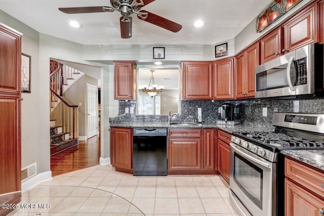 53 Grassmere Ct Unit 1, Freehold, NJ 07728 - kitchen featuring appliances with stainless steel finishes, ceiling fan, decorative backsplash, light tile patterned floors, and recessed lighting