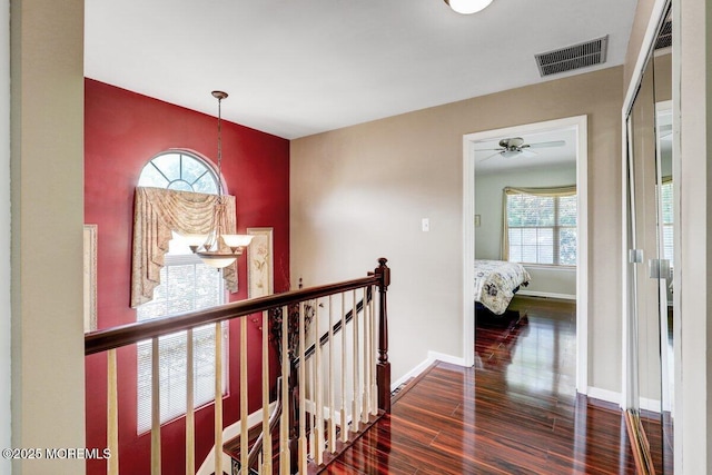 53 Grassmere Ct Unit 1, Freehold, NJ 07728 - hall featuring wood finished floors and an upstairs landing
