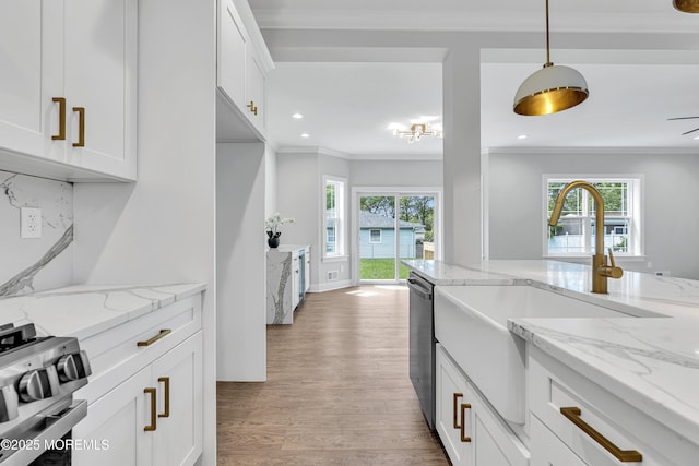 127 Rogers St, Bayville, NJ 08721 - kitchen with stainless steel appliances, crown molding, wood finished floors, white cabinets, and decorative light fixtures