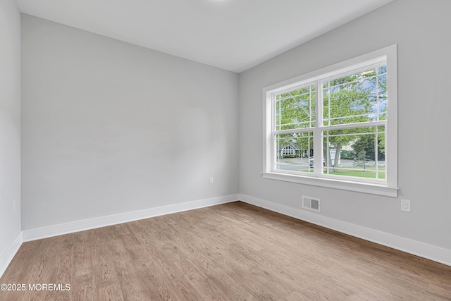 127 Rogers St, Bayville, NJ 08721 - unfurnished room with wood finished floors and baseboards