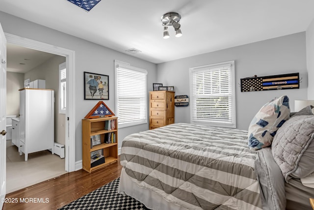 20 Wardell Ave, Rumson, NJ 07760 - bedroom featuring multiple windows, wood finished floors, and baseboard heating