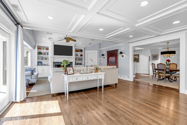 20 Wardell Ave, Rumson, NJ 07760 - living area featuring coffered ceiling, wood finished floors, a fireplace, a ceiling fan, and built in features