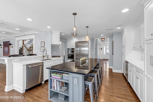 20 Wardell Ave, Rumson, NJ 07760 - kitchen with appliances with stainless steel finishes, a kitchen bar, beverage cooler, white cabinetry, and recessed lighting