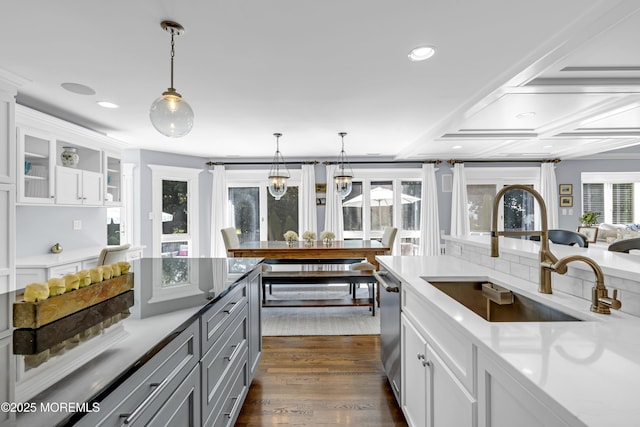 20 Wardell Ave, Rumson, NJ 07760 - kitchen with white cabinets, decorative light fixtures, glass insert cabinets, stainless steel dishwasher, and recessed lighting