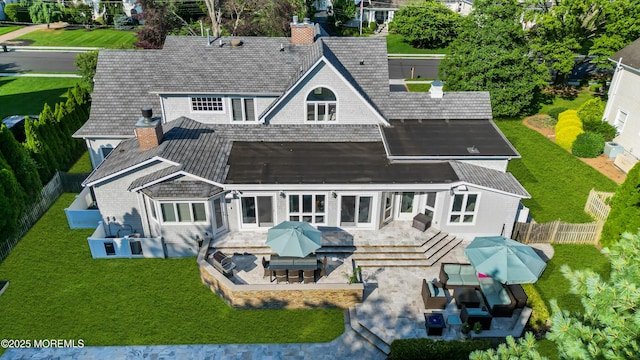 20 Wardell Ave, Rumson, NJ 07760 - back of property featuring a chimney, a fenced backyard, an outdoor living space, and a patio area