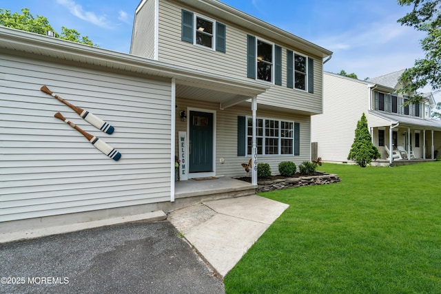 1066 Windlass Dr, Manahawkin, NJ 08050 - view of front of property featuring a porch and a front yard