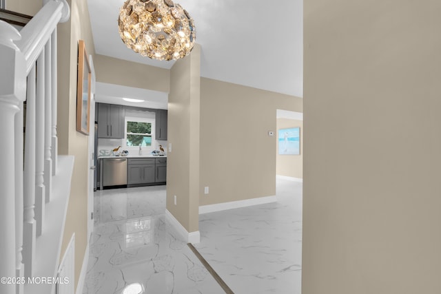 1066 Windlass Dr, Manahawkin, NJ 08050 - hallway featuring light marble finish floors and a chandelier