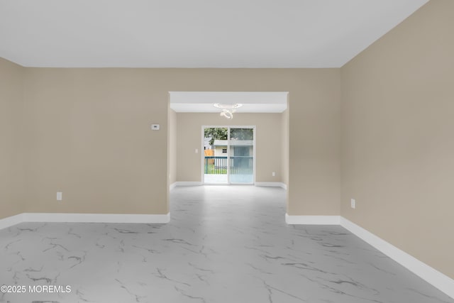 1066 Windlass Dr, Manahawkin, NJ 08050 - spare room with marble look tiles and a chandelier