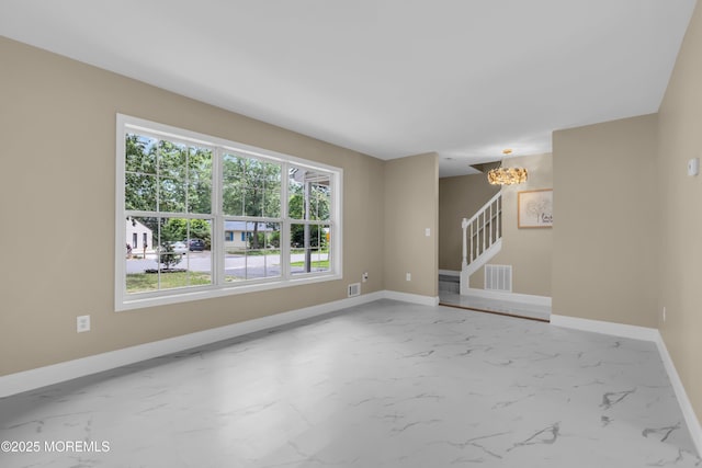 1066 Windlass Dr, Manahawkin, NJ 08050 - unfurnished living room featuring marble finish floors, stairway, and a chandelier
