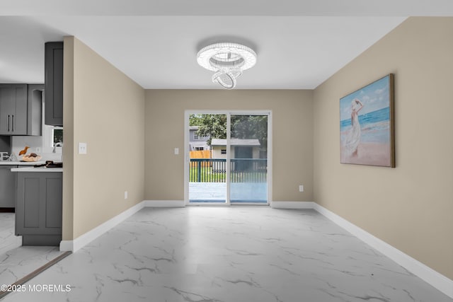 1066 Windlass Dr, Manahawkin, NJ 08050 - unfurnished dining area featuring light marble finish floors and a chandelier