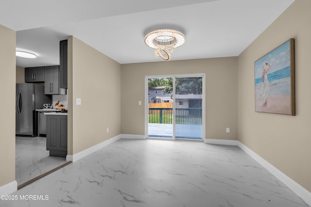 1066 Windlass Dr, Manahawkin, NJ 08050 - unfurnished dining area with light marble finish floors and a chandelier