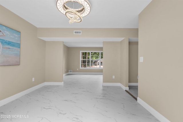 1066 Windlass Dr, Manahawkin, NJ 08050 - unfurnished room with a chandelier and marble look tile flooring