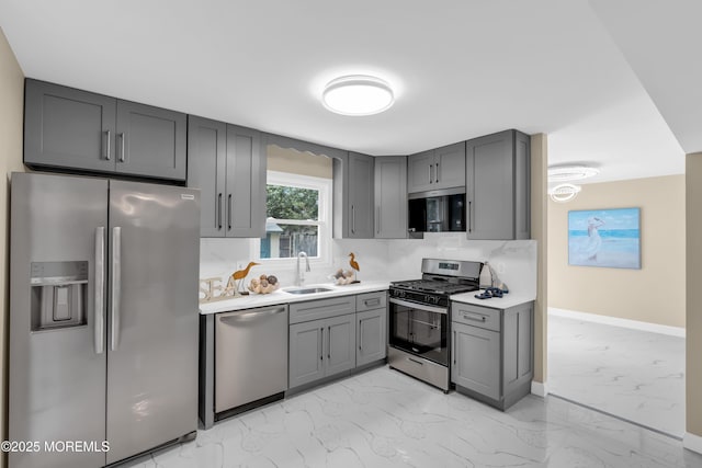 1066 Windlass Dr, Manahawkin, NJ 08050 - kitchen with light marble finish floors, stainless steel appliances, gray cabinetry, and light countertops
