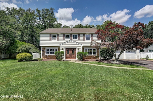 25 Forman Ln, Manalapan, NJ 07726 - colonial house with driveway, a garage, and stone siding