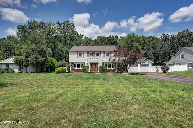 25 Forman Ln, Manalapan, NJ 07726 - view of front of house with french doors, asphalt driveway, and an attached garage