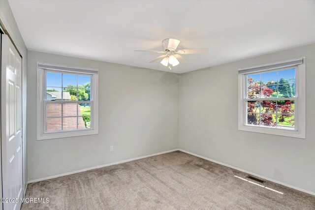 25 Forman Ln, Manalapan, NJ 07726 - carpeted spare room featuring healthy amount of natural light and a ceiling fan