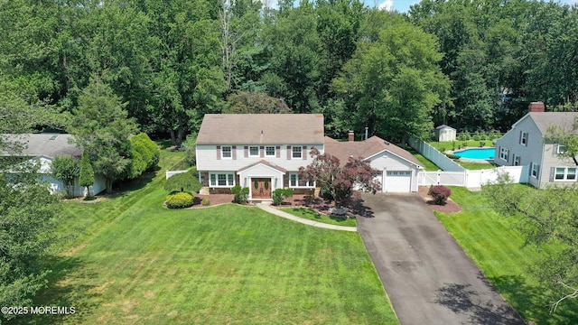 25 Forman Ln, Manalapan, NJ 07726 - view of front of home with driveway and a garage