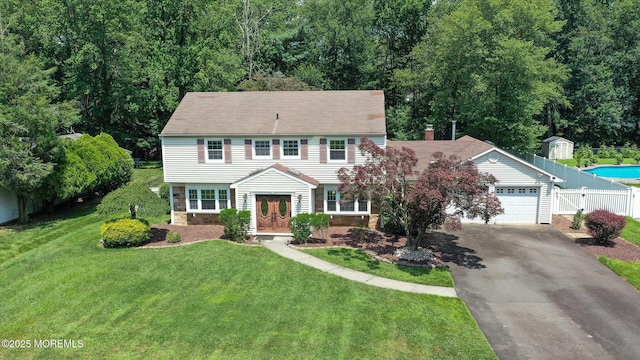 25 Forman Ln, Manalapan, NJ 07726 - colonial inspired home featuring asphalt driveway, an attached garage, and stone siding