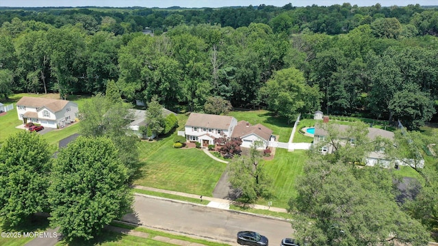 25 Forman Ln, Manalapan, NJ 07726 - aerial view of property and surrounding area featuring a heavily wooded area