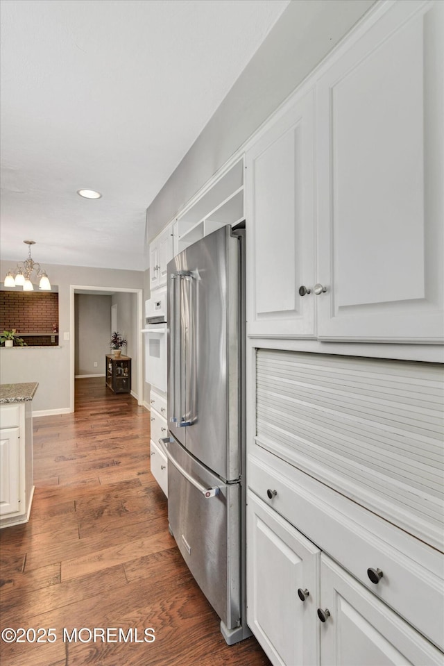 25 Forman Ln, Manalapan, NJ 07726 - kitchen featuring high end fridge, white oven, a chandelier, white cabinets, and dark wood finished floors