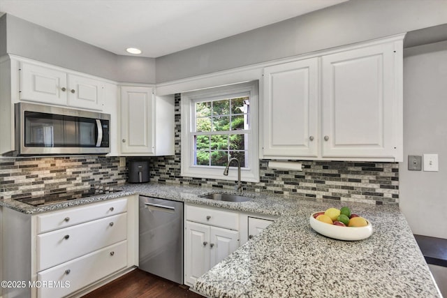 25 Forman Ln, Manalapan, NJ 07726 - kitchen featuring appliances with stainless steel finishes, backsplash, and white cabinets
