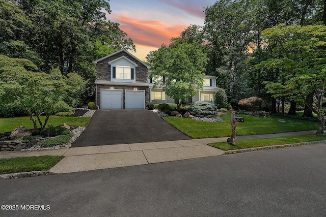 7 Lorraine Ct, East Brunswick, NJ 08816 - view of front of home with driveway, a garage, and a front yard