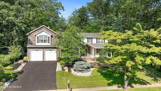 7 Lorraine Ct, East Brunswick, NJ 08816 - view of front facade featuring a garage, driveway, and a porch