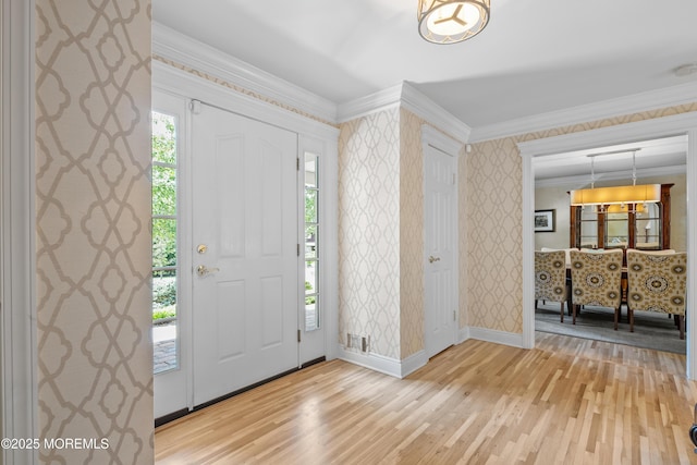 7 Lorraine Ct, East Brunswick, NJ 08816 - foyer featuring light wood-type flooring, crown molding, and wallpapered walls