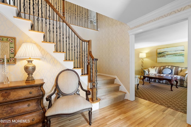 7 Lorraine Ct, East Brunswick, NJ 08816 - stairs featuring wallpapered walls, wood finished floors, and ornamental molding
