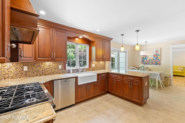 7 Lorraine Ct, East Brunswick, NJ 08816 - kitchen featuring dishwasher, decorative backsplash, light stone countertops, cooktop, and a peninsula