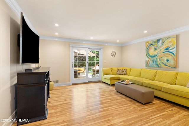 7 Lorraine Ct, East Brunswick, NJ 08816 - living area with crown molding, light wood finished floors, and recessed lighting