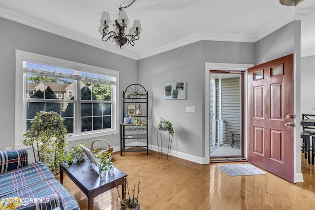 1602 Wagon Wheel Ct, Freehold, NJ 07728 - entryway with a chandelier, wood finished floors, and ornamental molding
