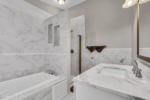 1602 Wagon Wheel Ct, Freehold, NJ 07728 - full bathroom with vanity, a garden tub, a marble finish shower, and tile walls