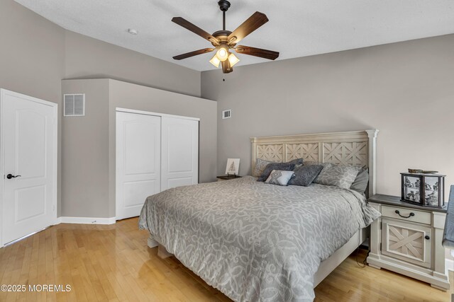1602 Wagon Wheel Ct, Freehold, NJ 07728 - bedroom with a closet, high vaulted ceiling, light wood finished floors, and a ceiling fan