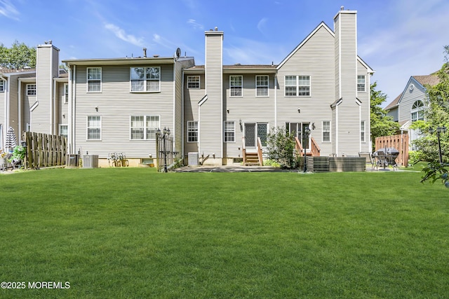 1602 Wagon Wheel Ct, Freehold, NJ 07728 - rear view of house featuring a chimney, entry steps, and a patio area