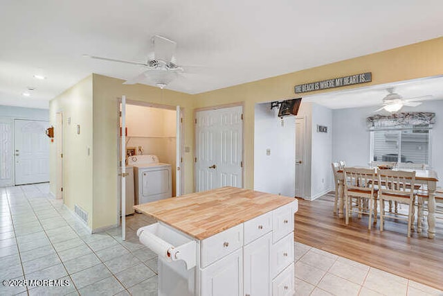 12 Peggy Ln, Beach Haven West, NJ 08050 - kitchen with a ceiling fan, light tile patterned floors, washing machine and clothes dryer, white cabinetry, and recessed lighting