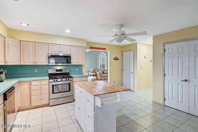 12 Peggy Ln, Beach Haven West, NJ 08050 - kitchen with appliances with stainless steel finishes, ceiling fan, light brown cabinets, and light tile patterned floors