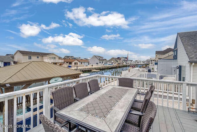 12 Peggy Ln, Beach Haven West, NJ 08050 - wooden terrace featuring outdoor dining space, a residential view, and a water view